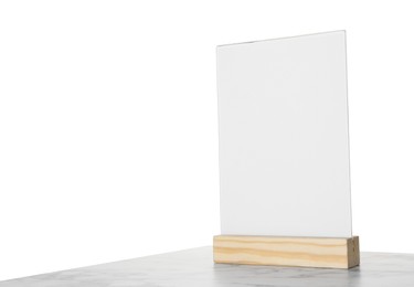 Photo of Menu holder on marble table against white background. Space for text