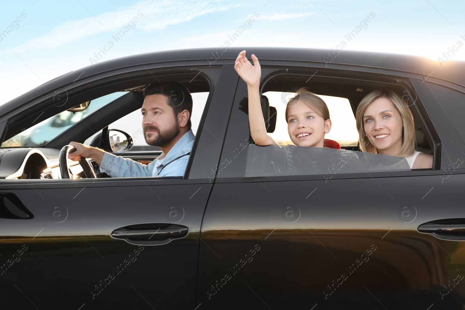 Photo of Happy family enjoying trip together by car, view from outside