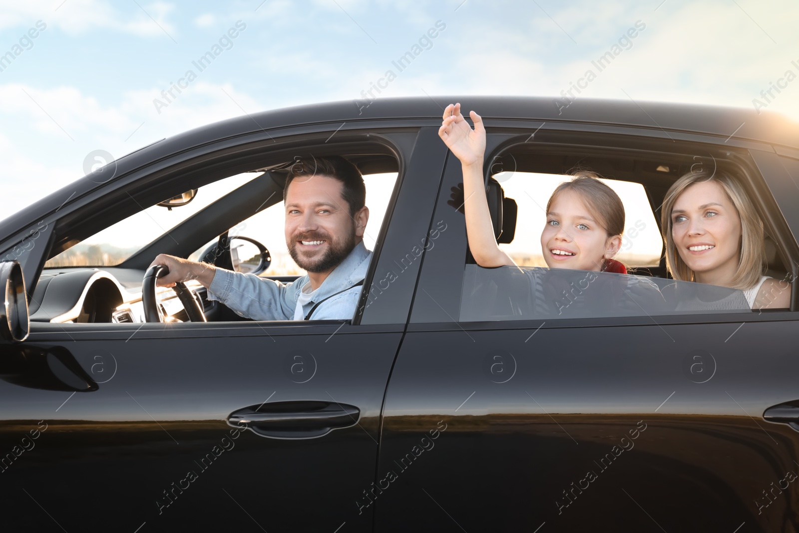 Photo of Happy family enjoying trip together by car, view from outside