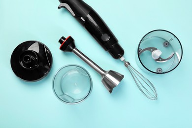 Photo of Hand blender kit on light blue background, flat lay