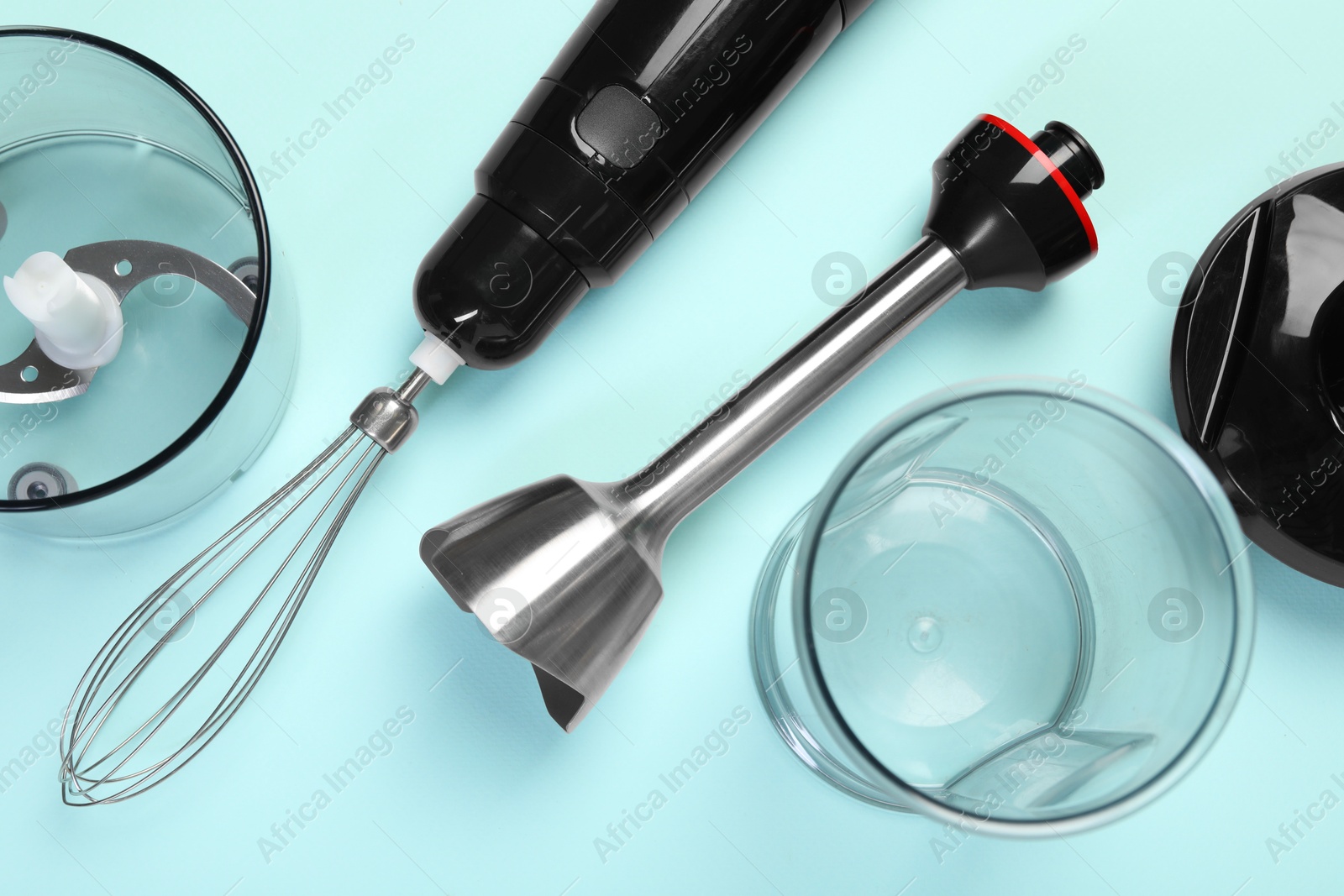 Photo of Hand blender kit on light blue background, flat lay