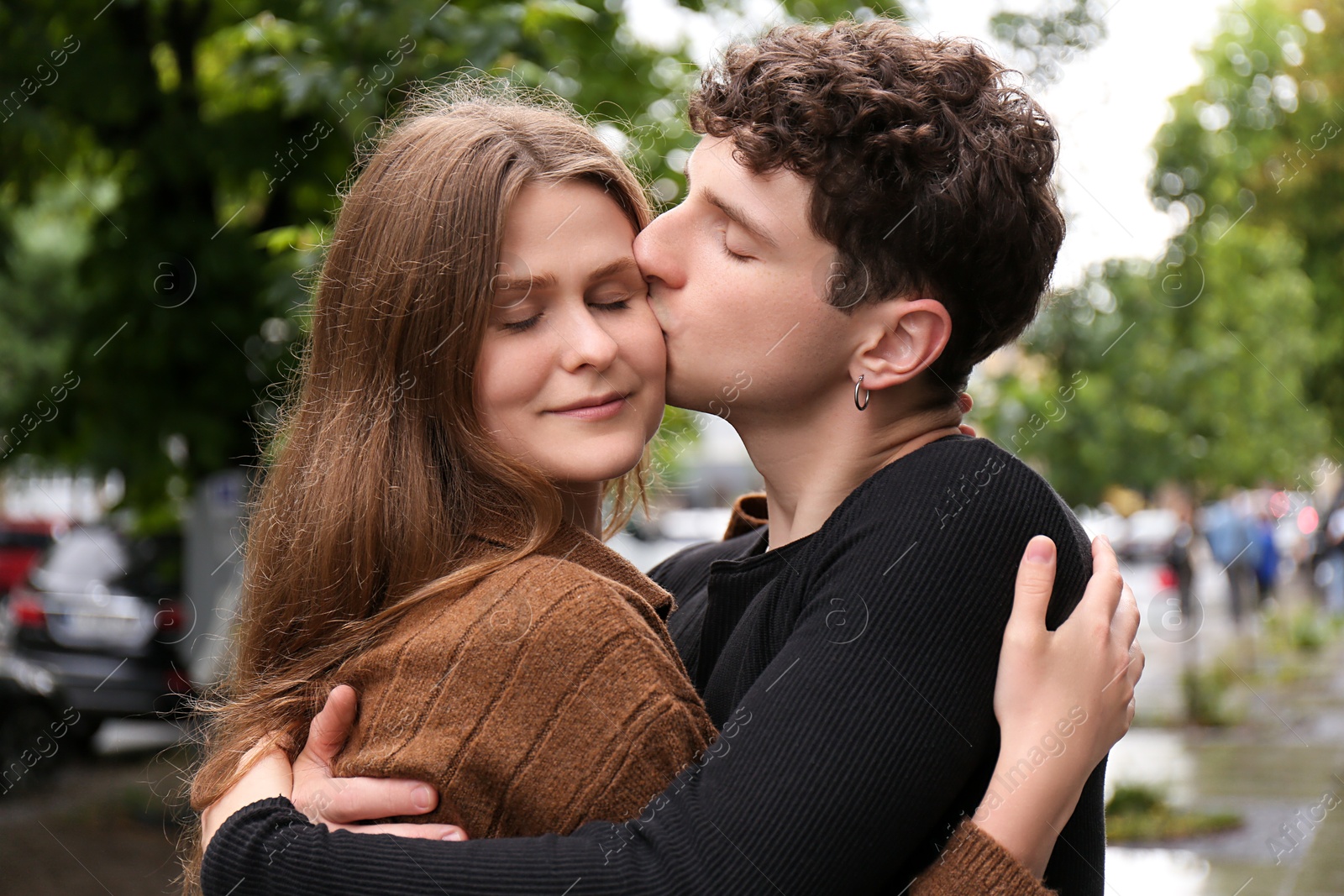 Photo of International dating. Lovely young couple spending time together outdoors