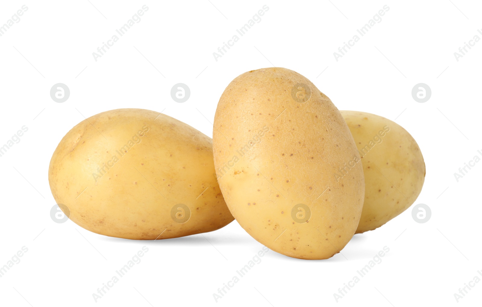 Photo of Three young fresh potatoes isolated on white