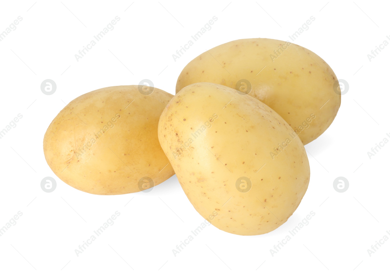 Photo of Three young fresh potatoes isolated on white