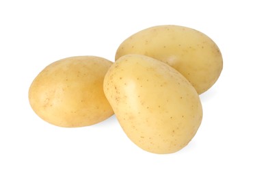 Photo of Three young fresh potatoes isolated on white