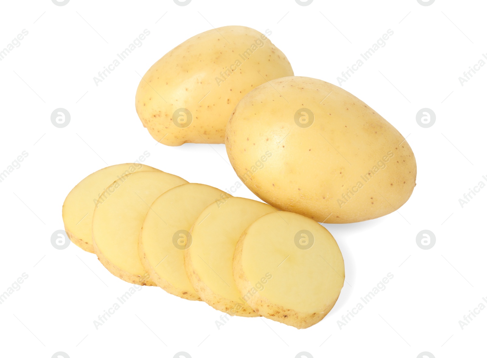 Photo of Fresh whole and cut potatoes isolated on white, above view