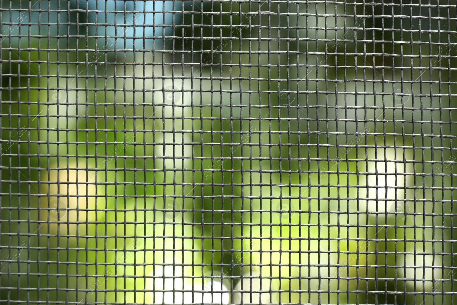 Photo of Insect screen for window against blurred background, closeup