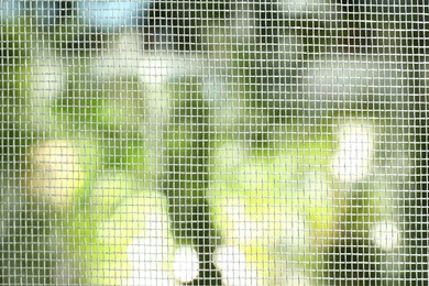 Photo of Insect screen for window against blurred background, closeup