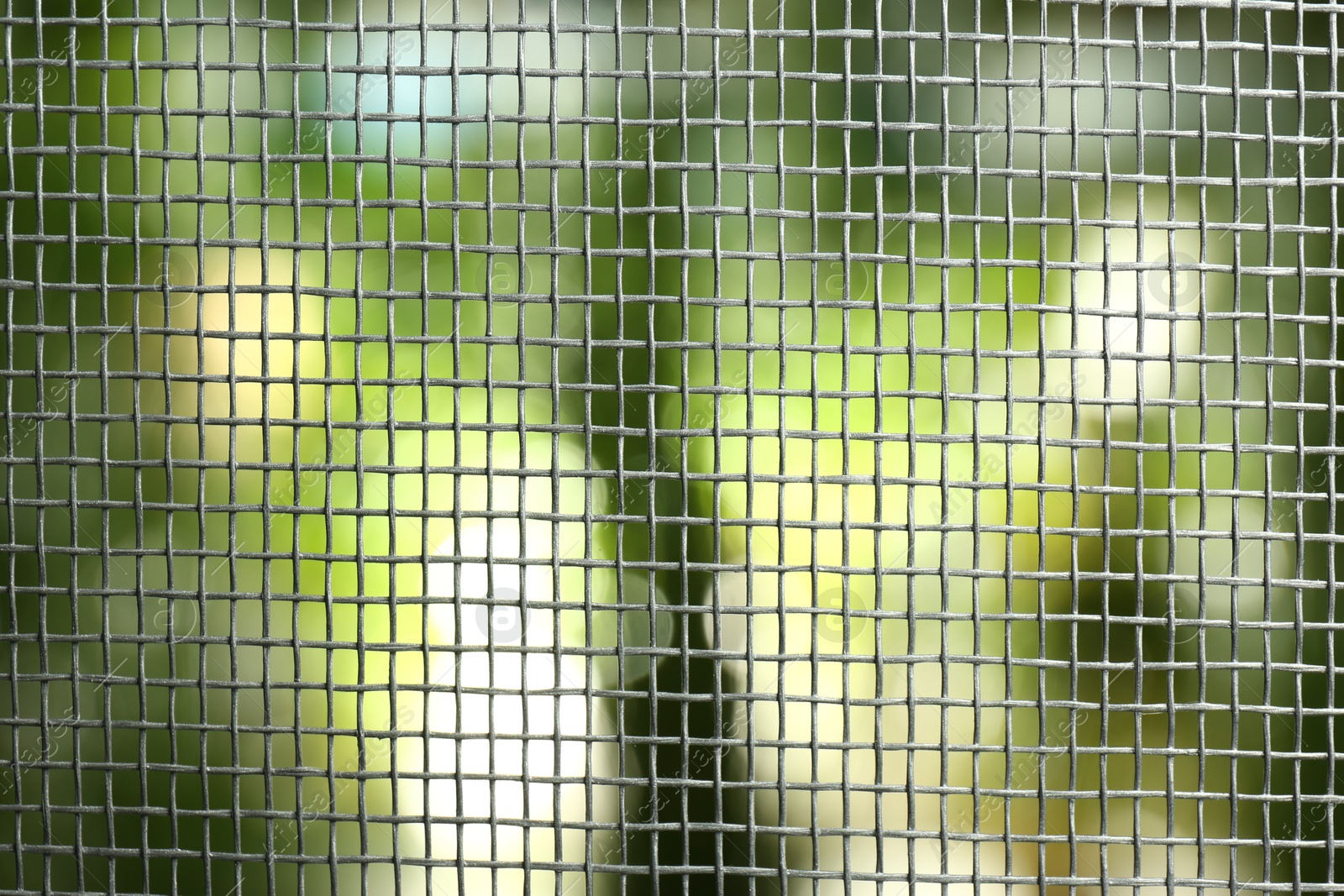 Photo of Insect screen for window against blurred background, closeup