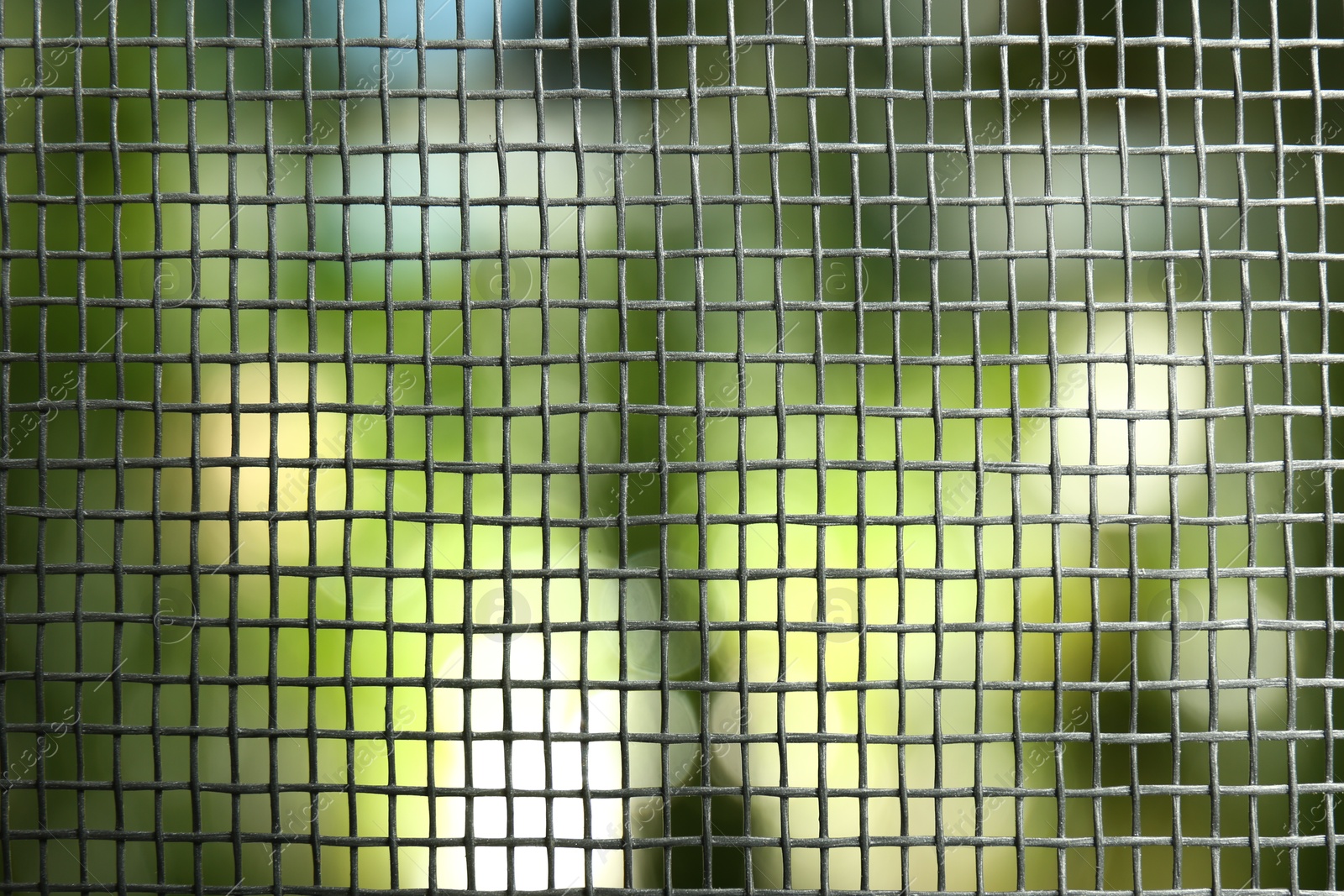 Photo of Insect screen for window against blurred background, closeup