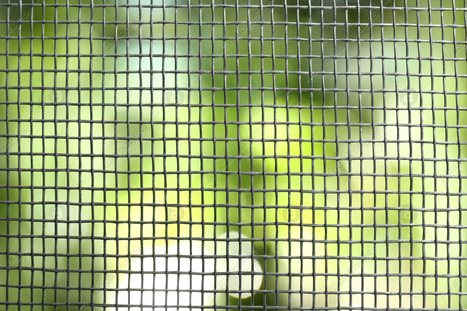 Photo of Insect screen for window against blurred background, closeup