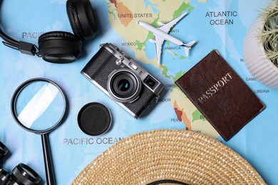 Photo of Flat lay composition with travel blogger`s items on light blue background