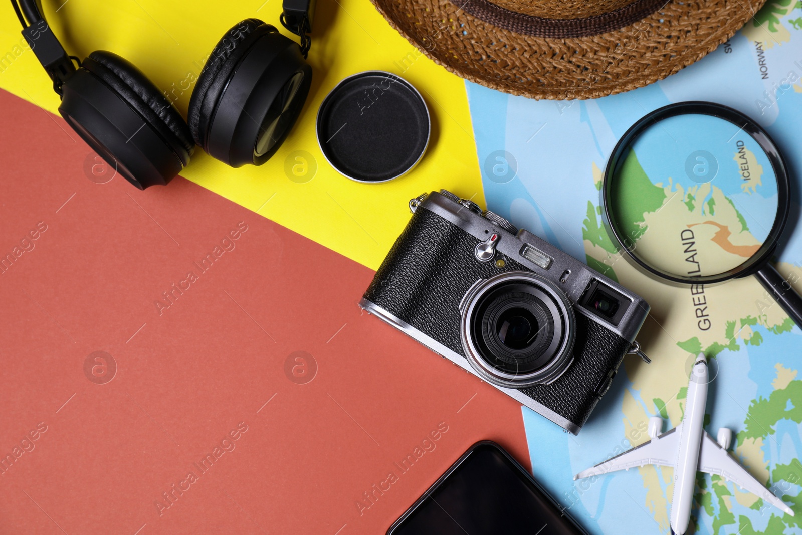 Photo of Flat lay composition with travel blogger`s items on color background