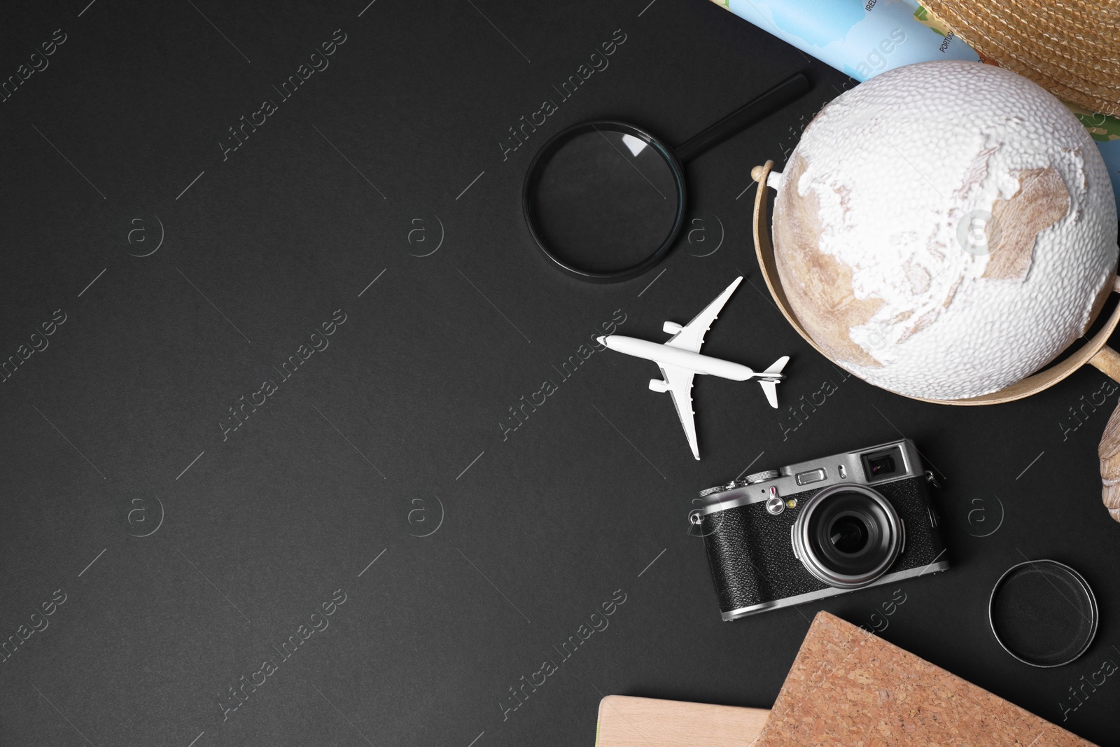 Photo of Travel blogger. Flat lay composition with vintage camera on black background, space for text