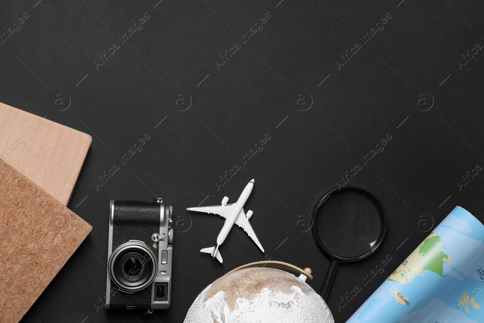 Photo of Travel blogger. Flat lay composition with vintage camera on black background, space for text