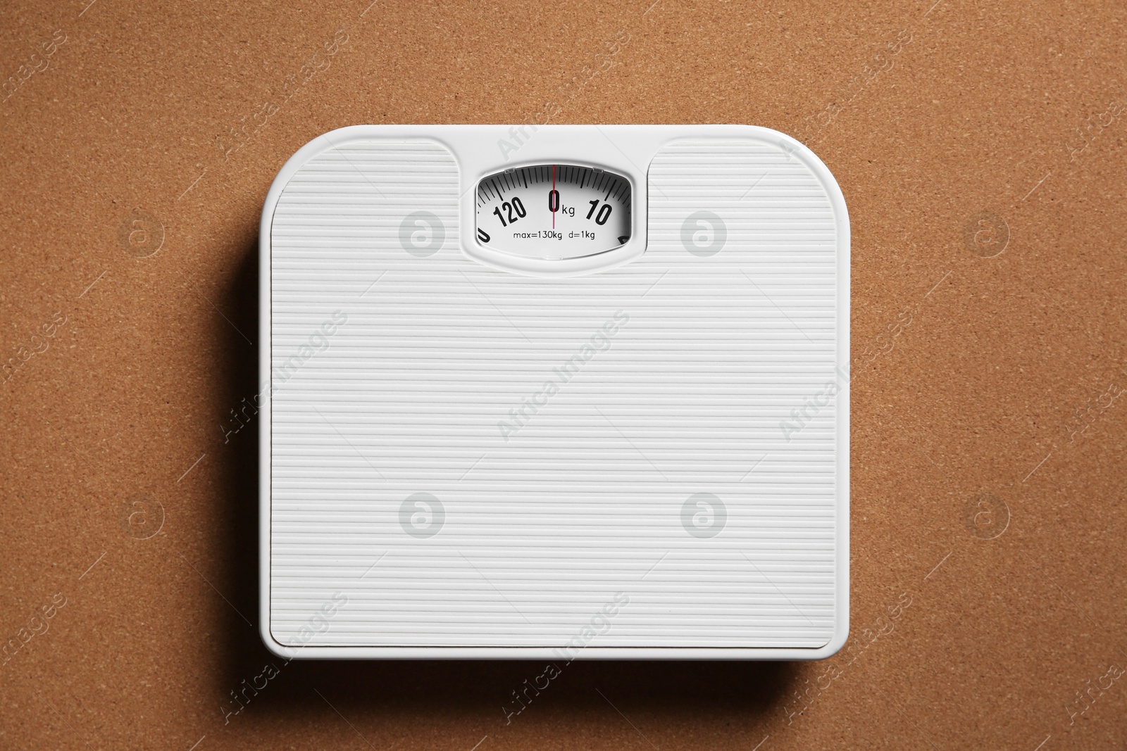 Photo of One bathroom scale on brown textured background, top view