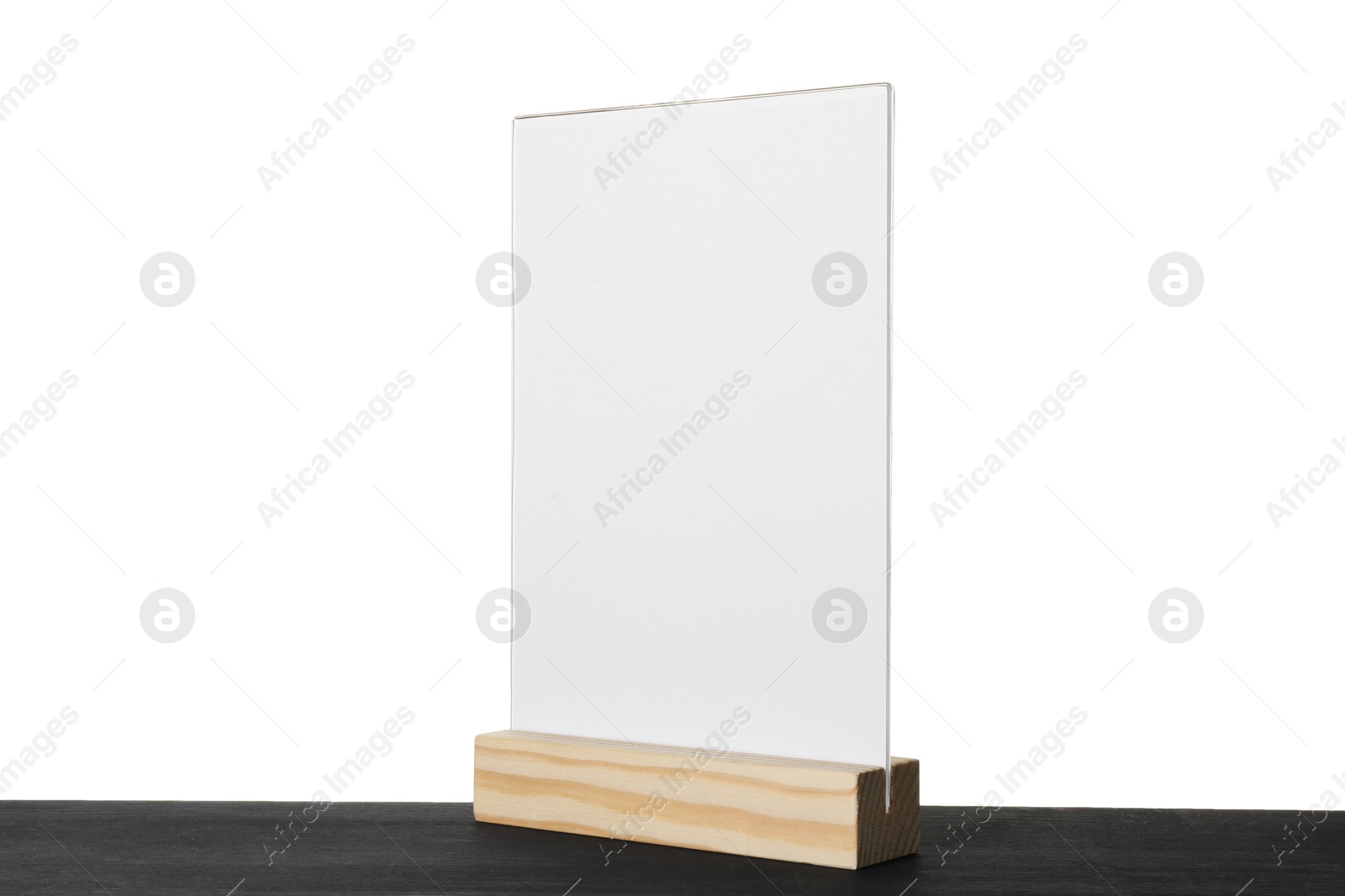 Photo of Menu holder on black wooden table against white background. Mockup for design