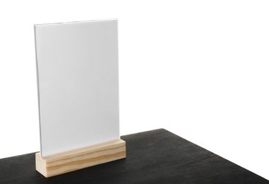 Photo of Menu holder on black wooden table against white background. Space for text