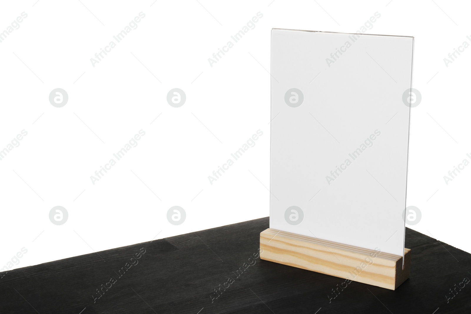 Photo of Menu holder on black wooden table against white background. Space for text