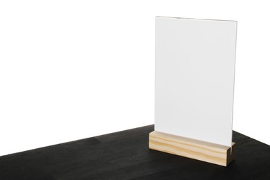 Photo of Menu holder on black wooden table against white background. Space for text