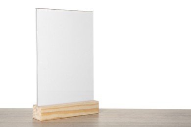 Photo of Menu holder on wooden table against white background. Space for text