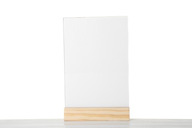 Photo of Menu holder on wooden table against white background. Mockup for design