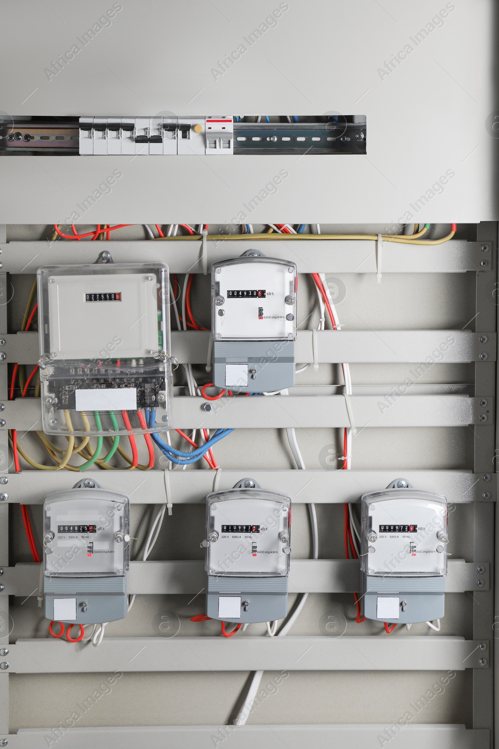 Photo of Electric meters and wires in fuse box. Energy measuring device