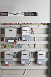 Electric meters and wires in fuse box. Energy measuring device