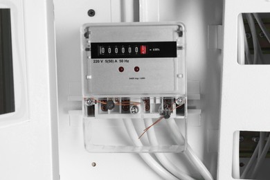 Photo of Electric meter and wires in fuse box. Energy measuring device