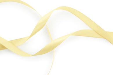 Photo of One beautiful light yellow ribbon isolated on white, top view