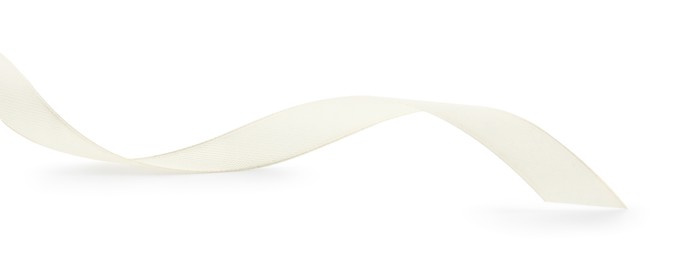 Photo of One beautiful beige ribbon isolated on white