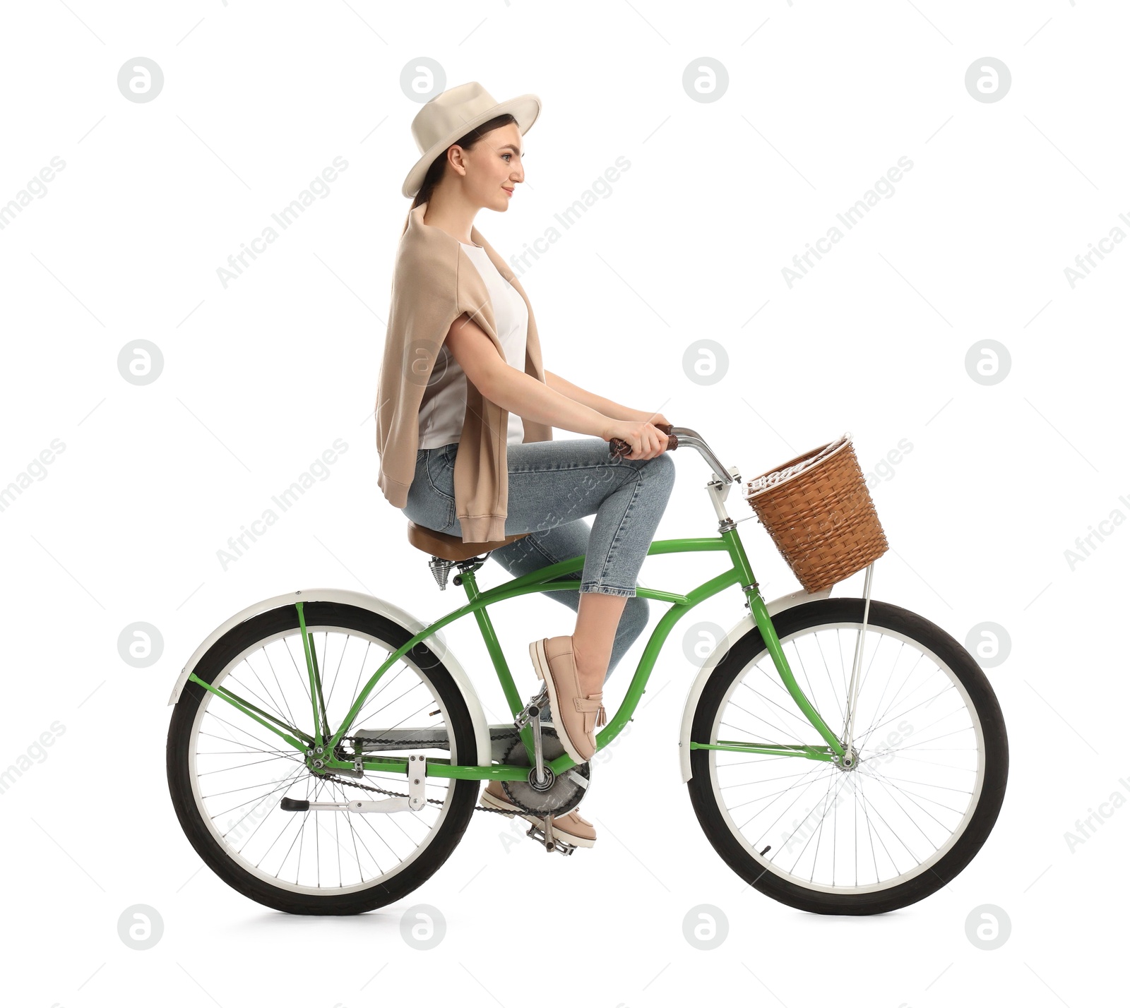 Photo of Beautiful young woman on bicycle with basket against white background