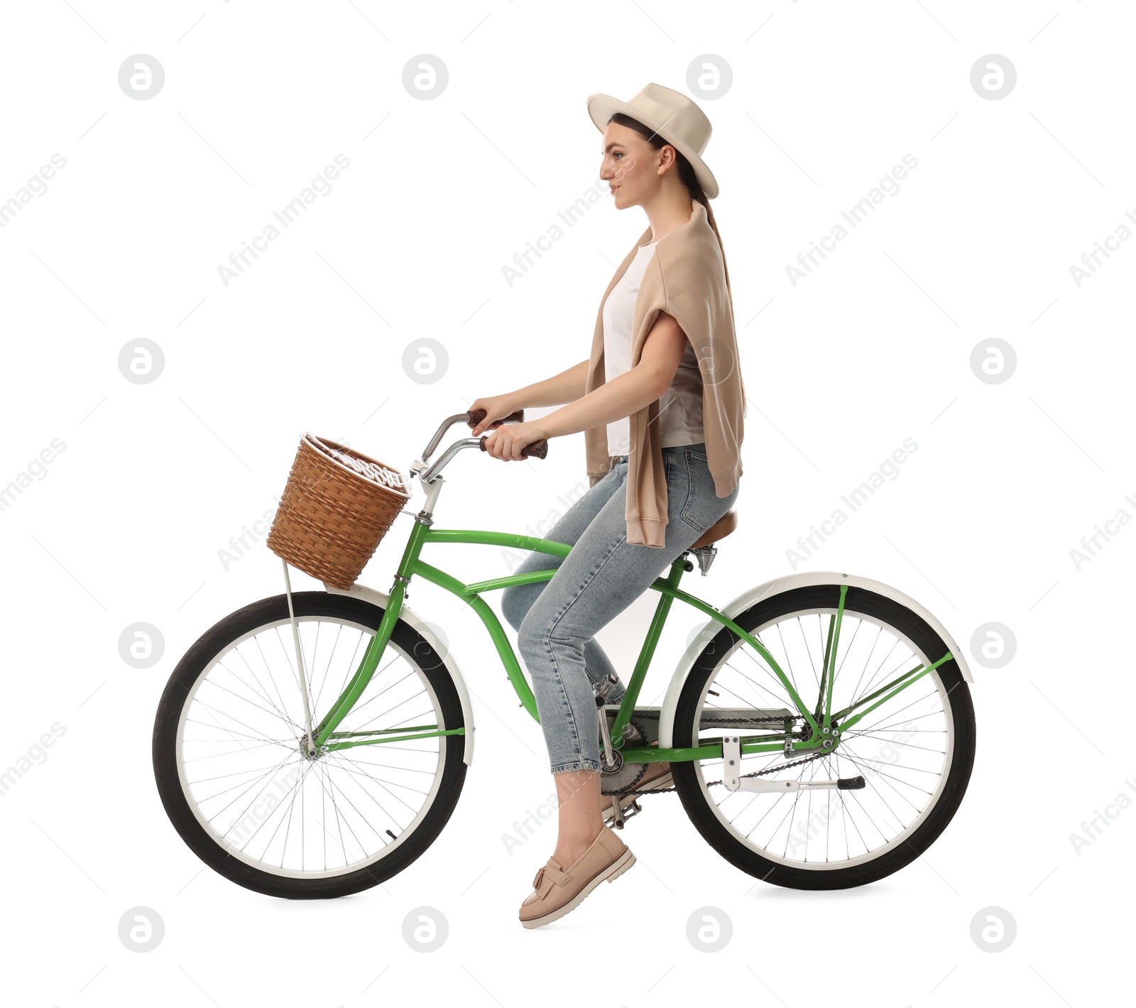 Photo of Beautiful young woman on bicycle with basket against white background