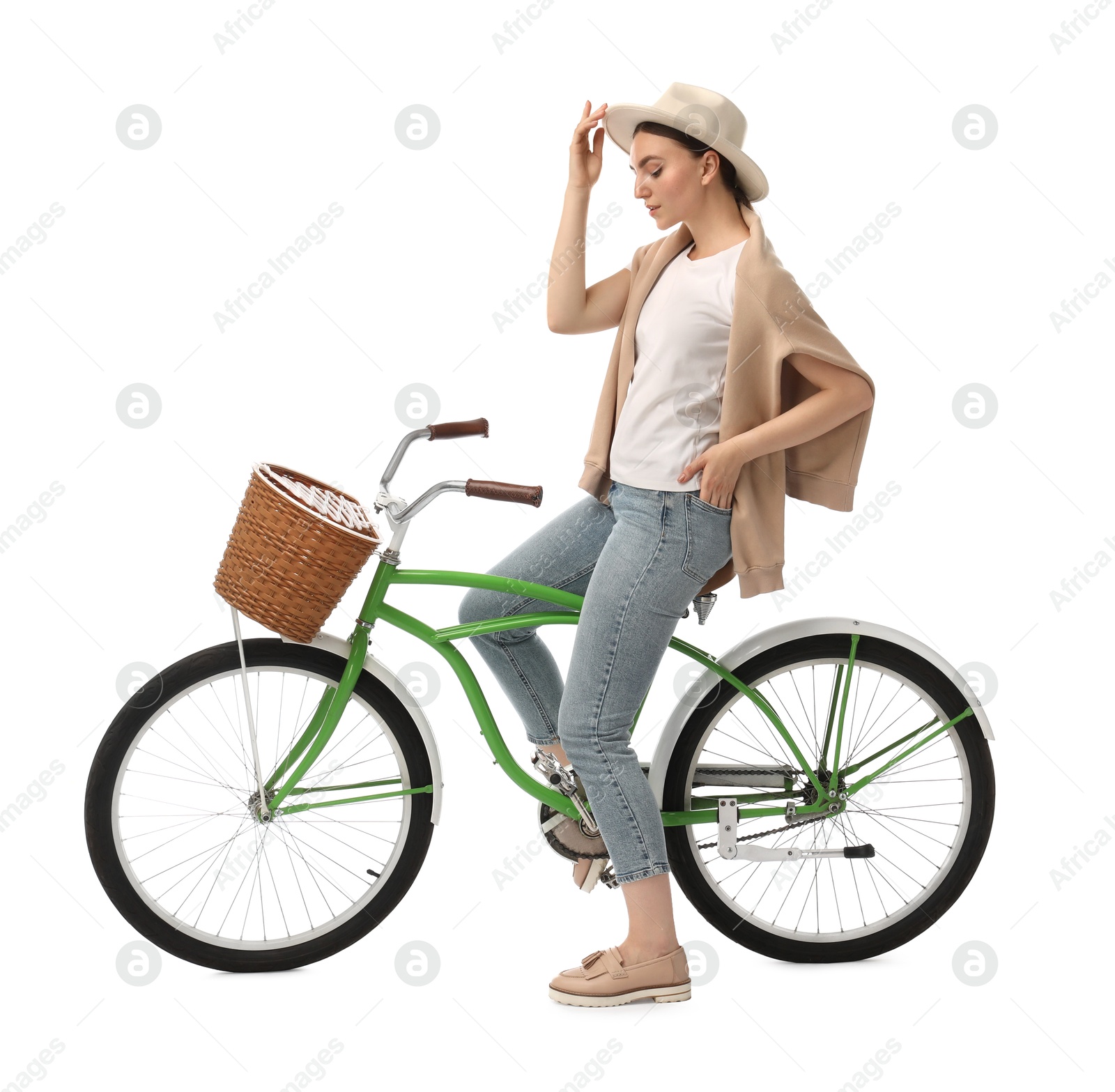 Photo of Beautiful young woman on bicycle with basket against white background