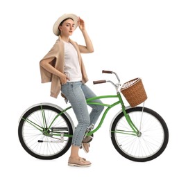 Photo of Beautiful young woman on bicycle with basket against white background