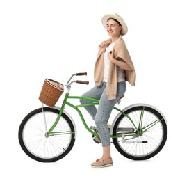 Photo of Smiling woman on bicycle with basket against white background