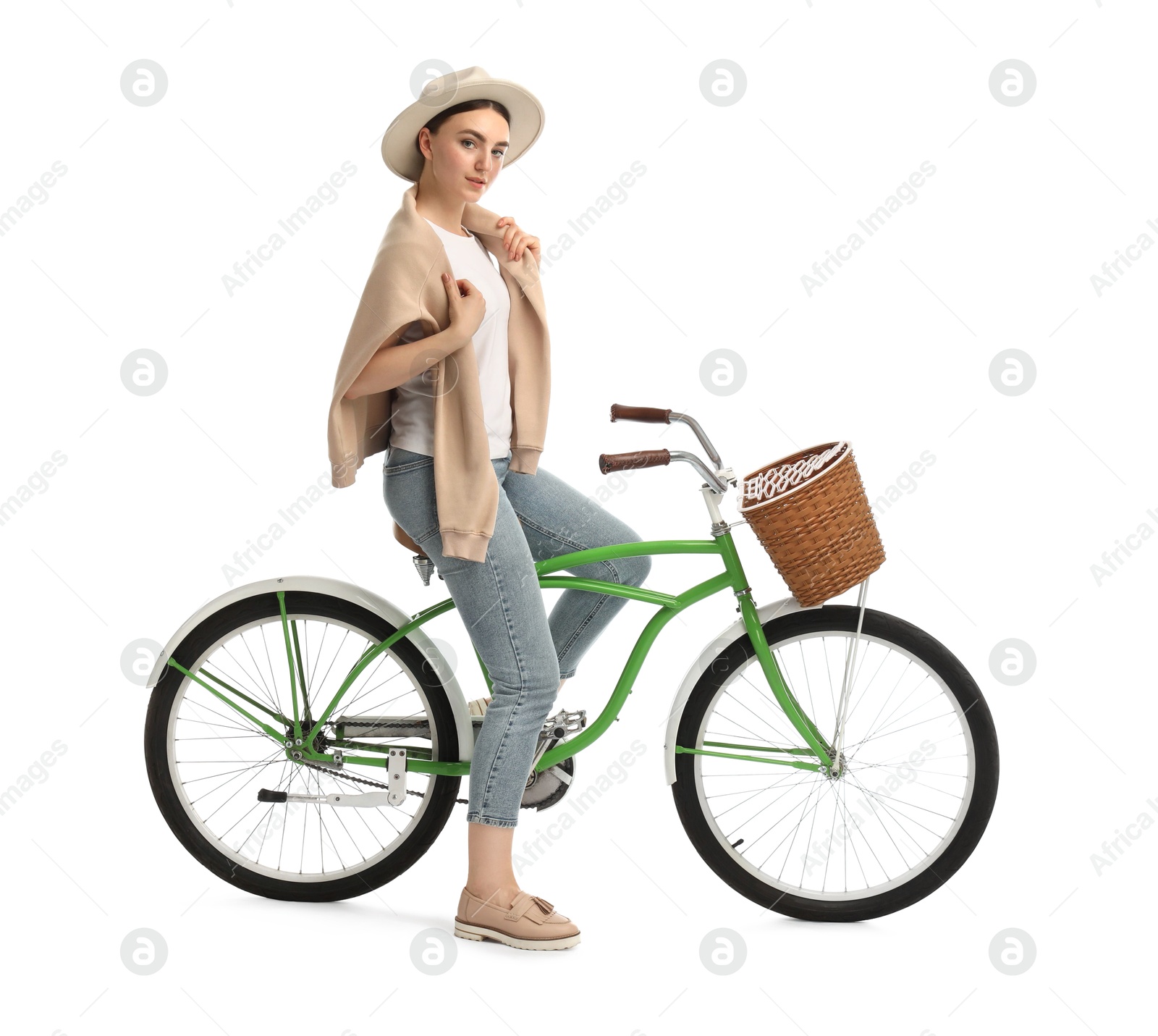 Photo of Beautiful young woman on bicycle with basket against white background