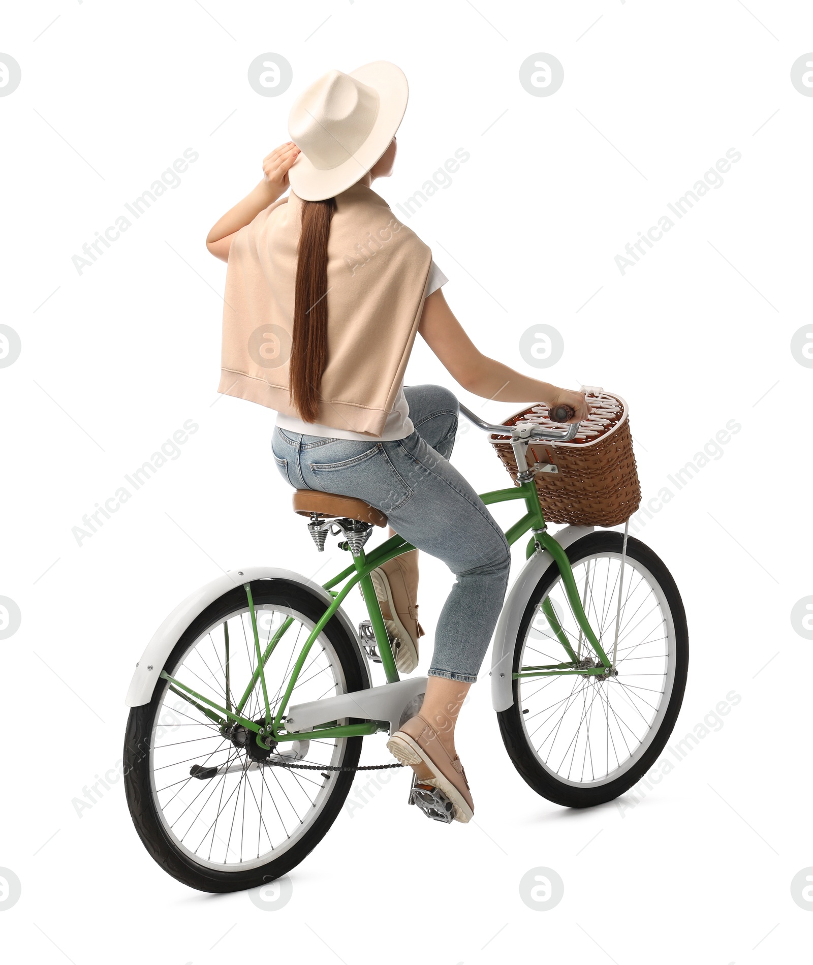 Photo of Woman on bicycle with basket against white background, back view