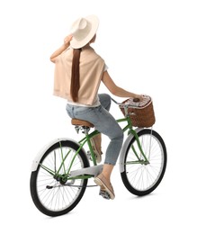 Photo of Woman on bicycle with basket against white background, back view