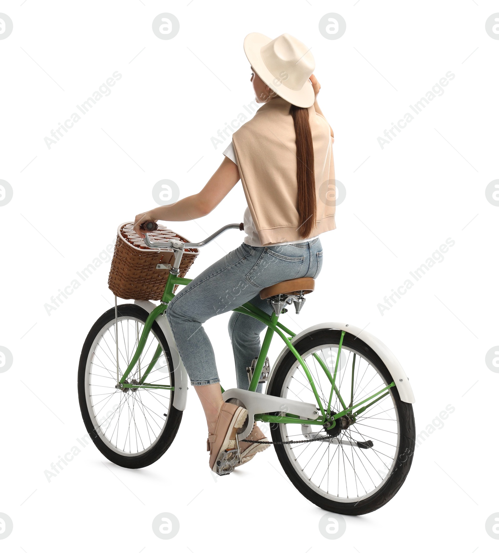 Photo of Woman on bicycle with basket against white background, back view