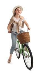 Photo of Smiling woman riding bicycle with basket against white background