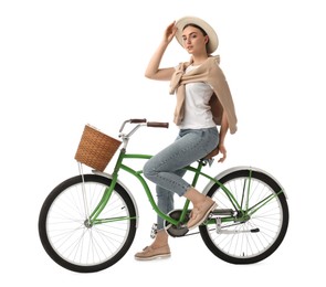 Photo of Beautiful young woman on bicycle with basket against white background