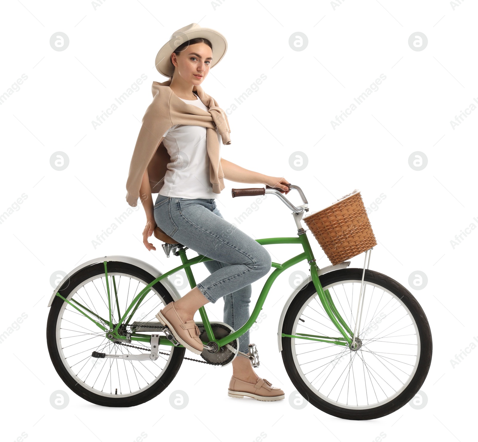 Photo of Beautiful young woman on bicycle with basket against white background