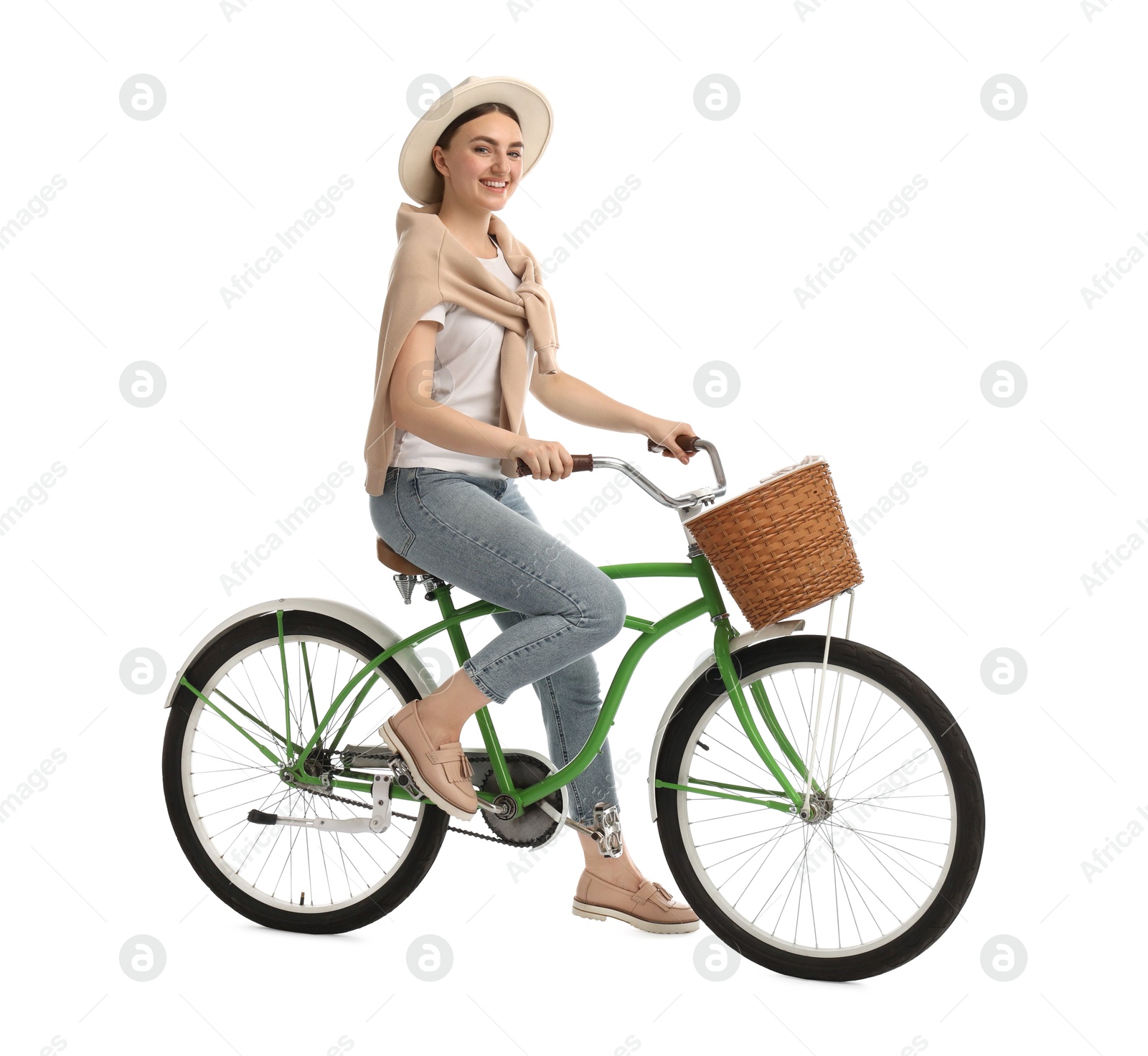 Photo of Smiling woman on bicycle with basket against white background