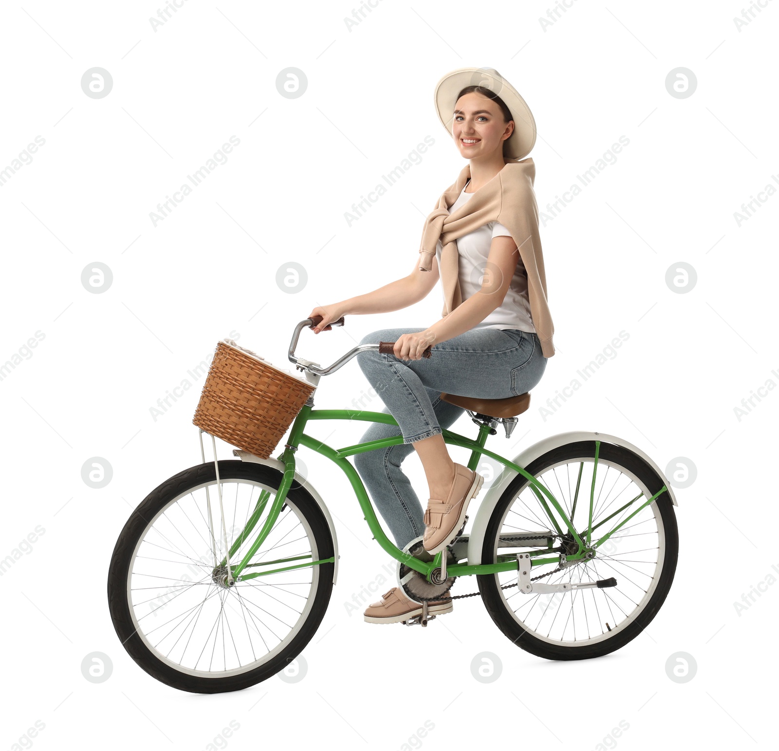 Photo of Smiling woman on bicycle with basket against white background