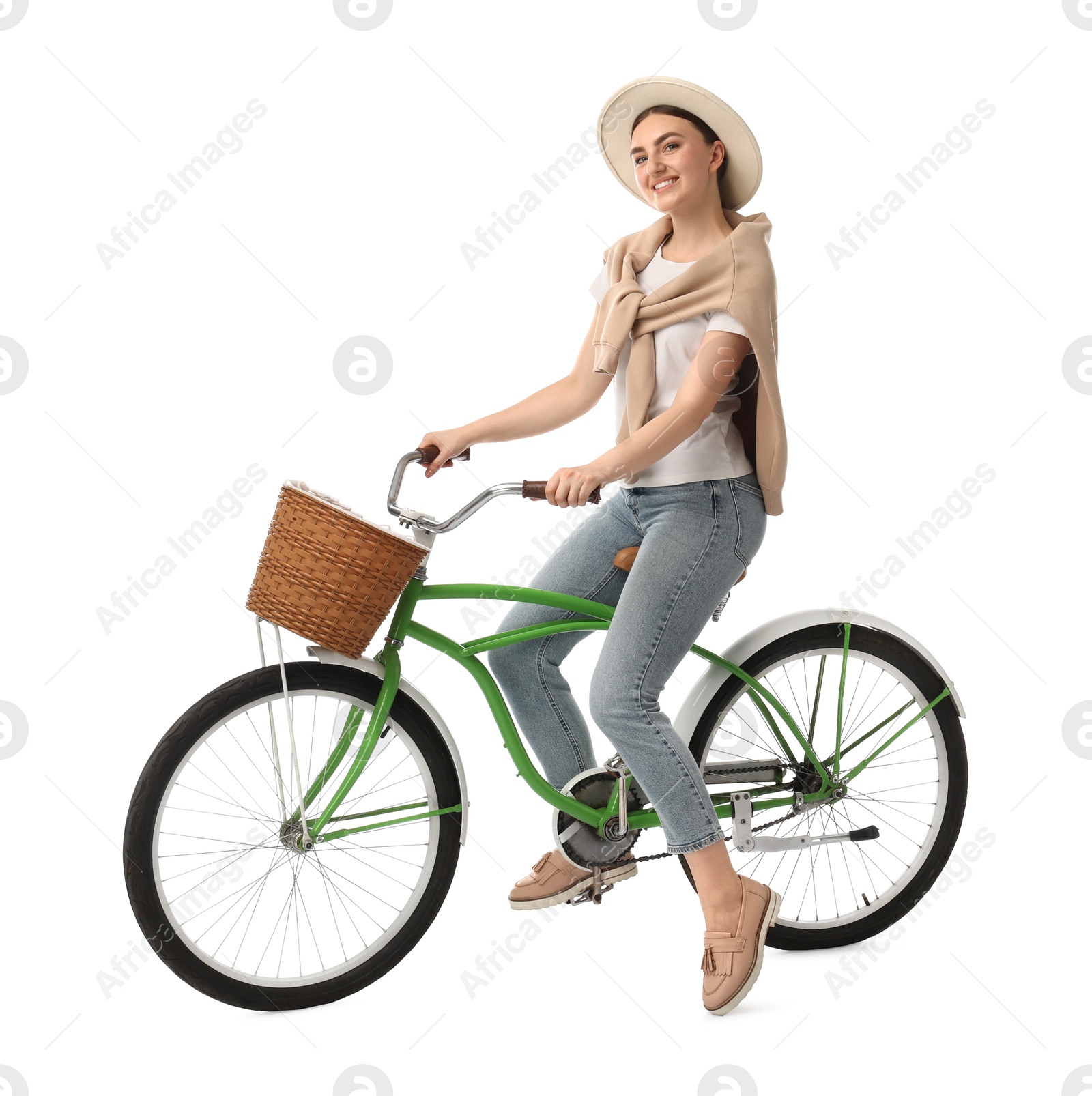 Photo of Smiling woman on bicycle with basket against white background