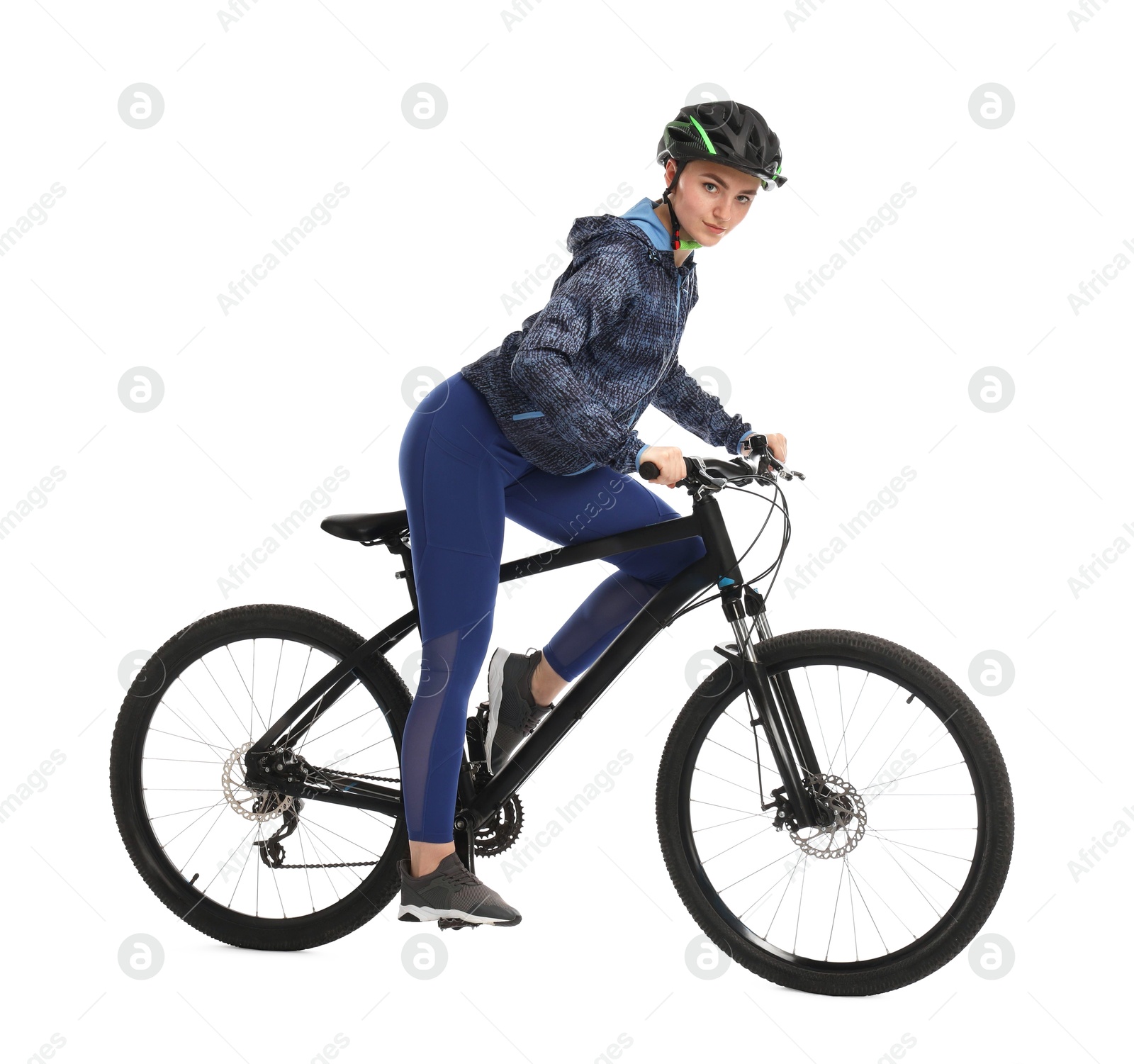 Photo of Beautiful young woman in helmet riding bicycle on white background