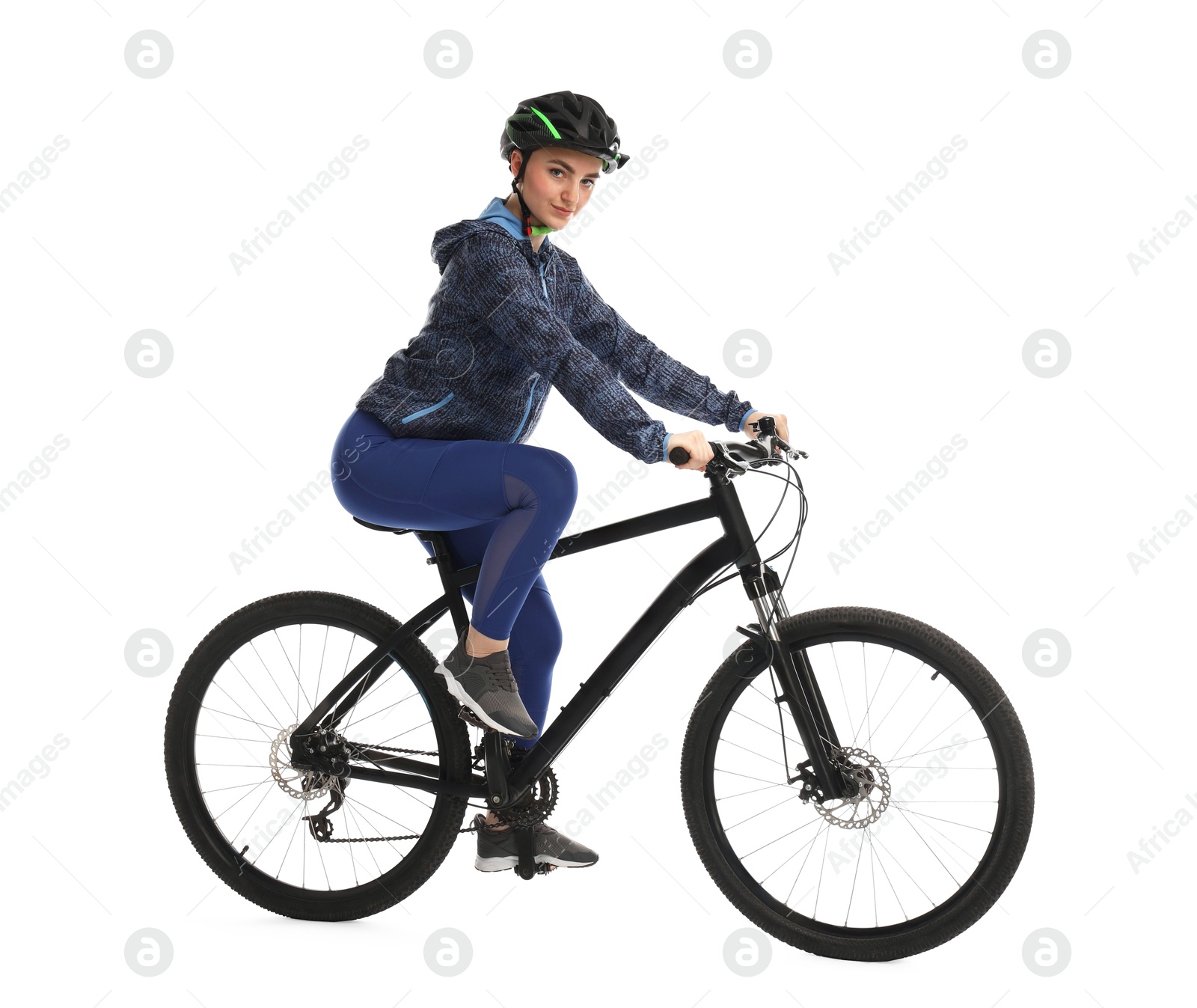 Photo of Beautiful young woman in helmet riding bicycle on white background