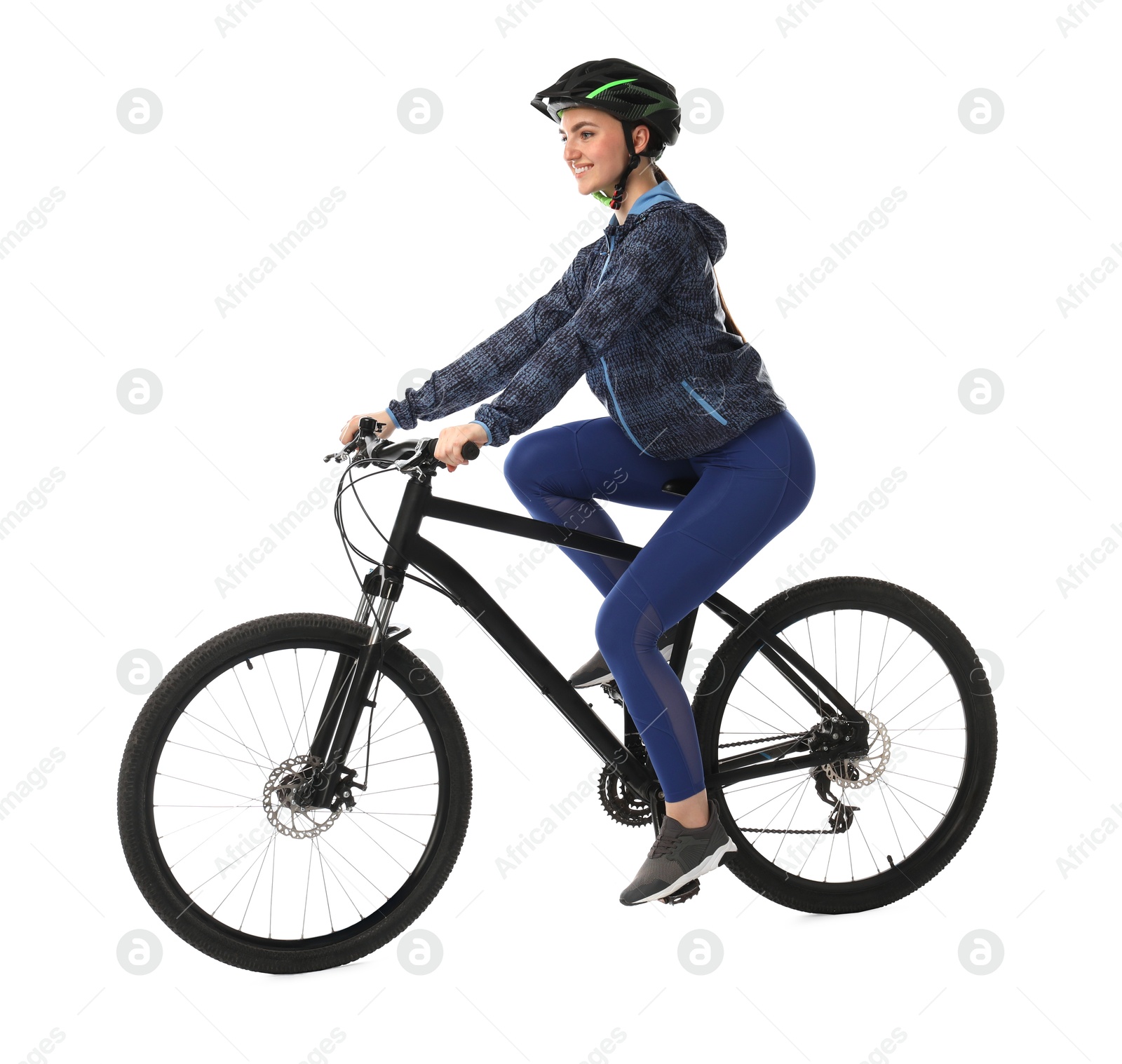 Photo of Smiling woman in helmet riding bicycle on white background