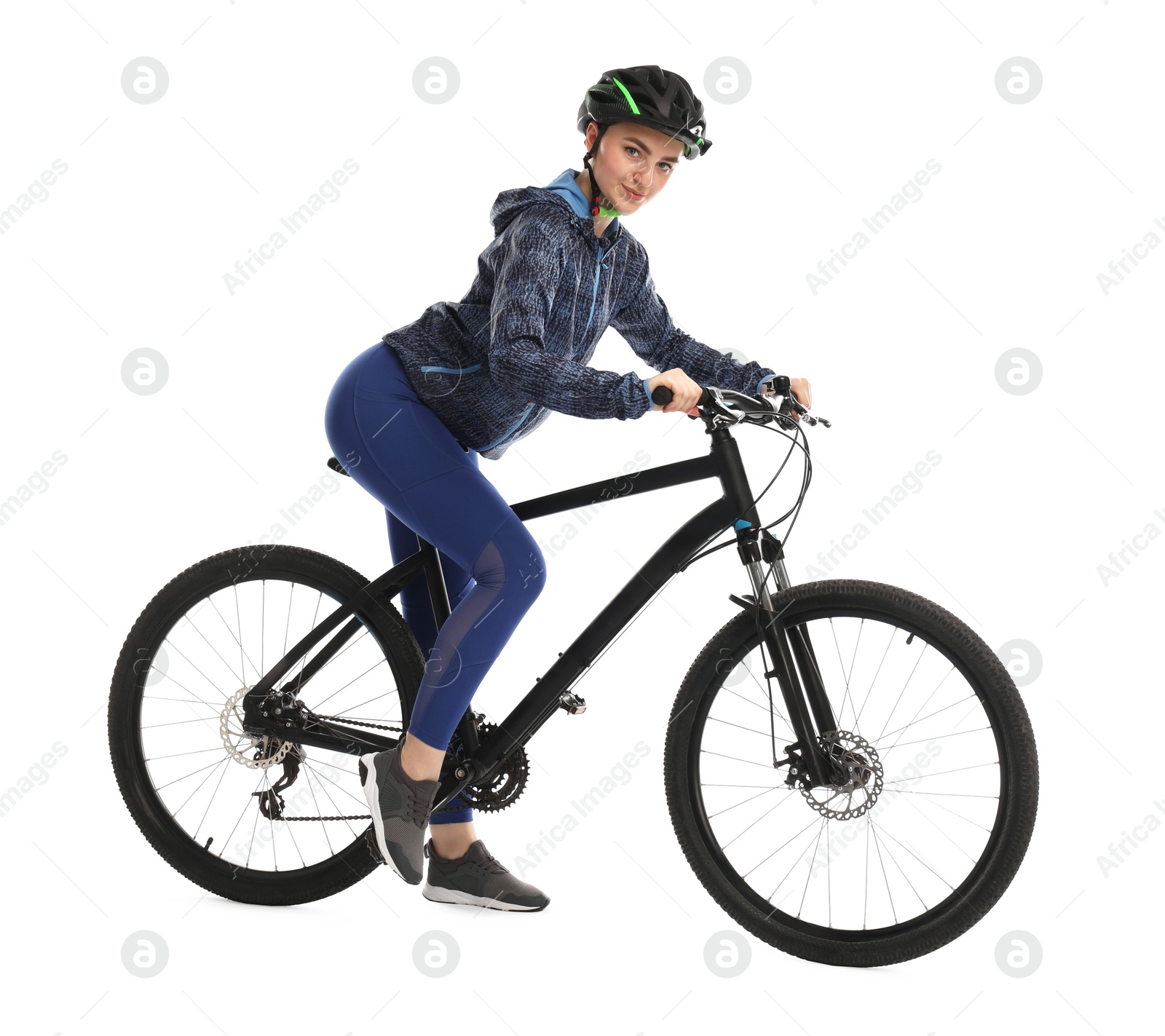 Photo of Beautiful young woman in helmet riding bicycle on white background